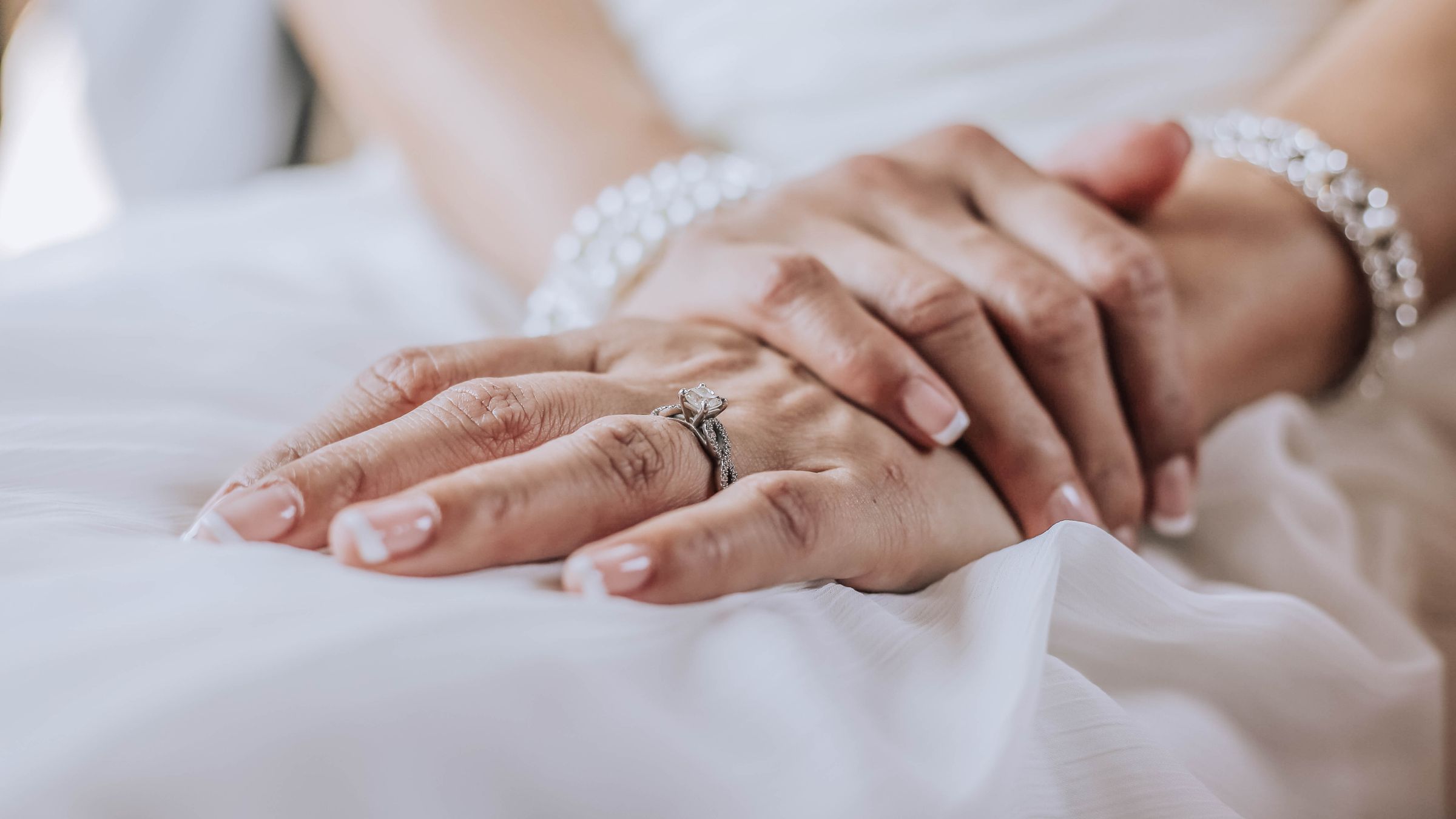 Bride's hand with a diamond ring